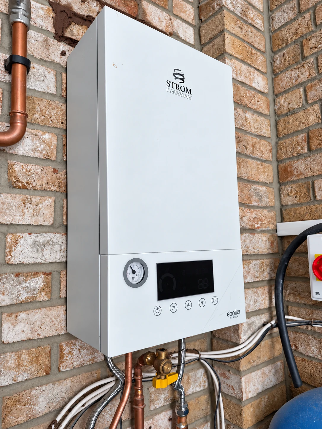 Strom 14.4kW electric system boiler installation by SwiftHeat UK Group Ltd, with its visible pipework and connections